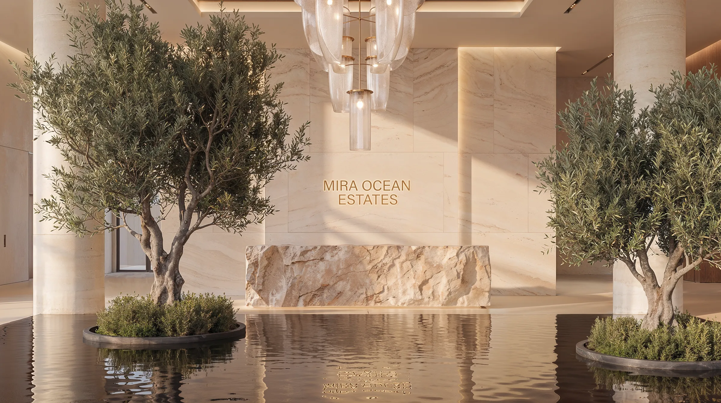 Reception desk cut from a single block of stone, olive trees planted in the reflecting pool either side