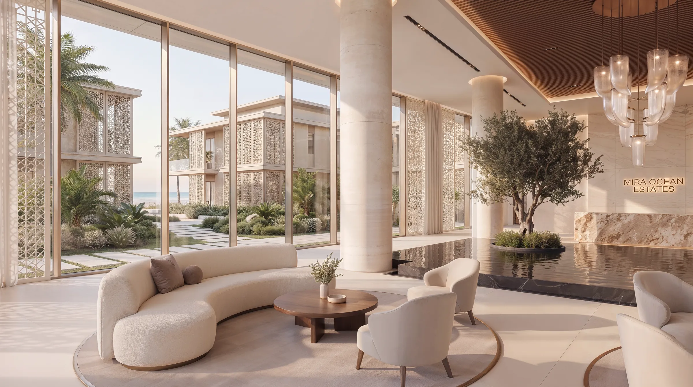 Lobby lounge looking out to the residence blocks and the sea, a curved sofa facing the glazing