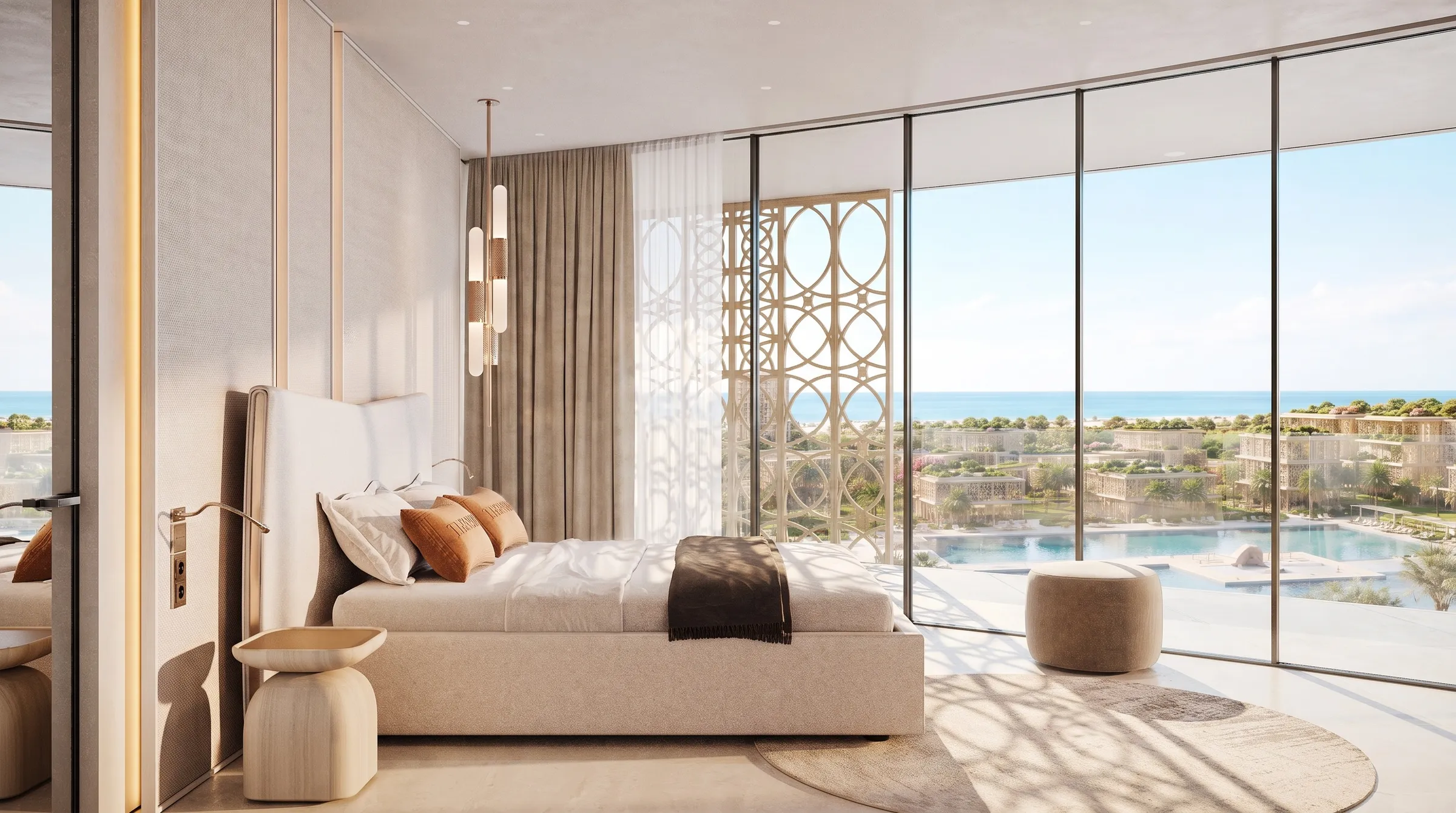 Bedroom suite with a tall upholstered headboard and full-height glazing onto the pool terrace