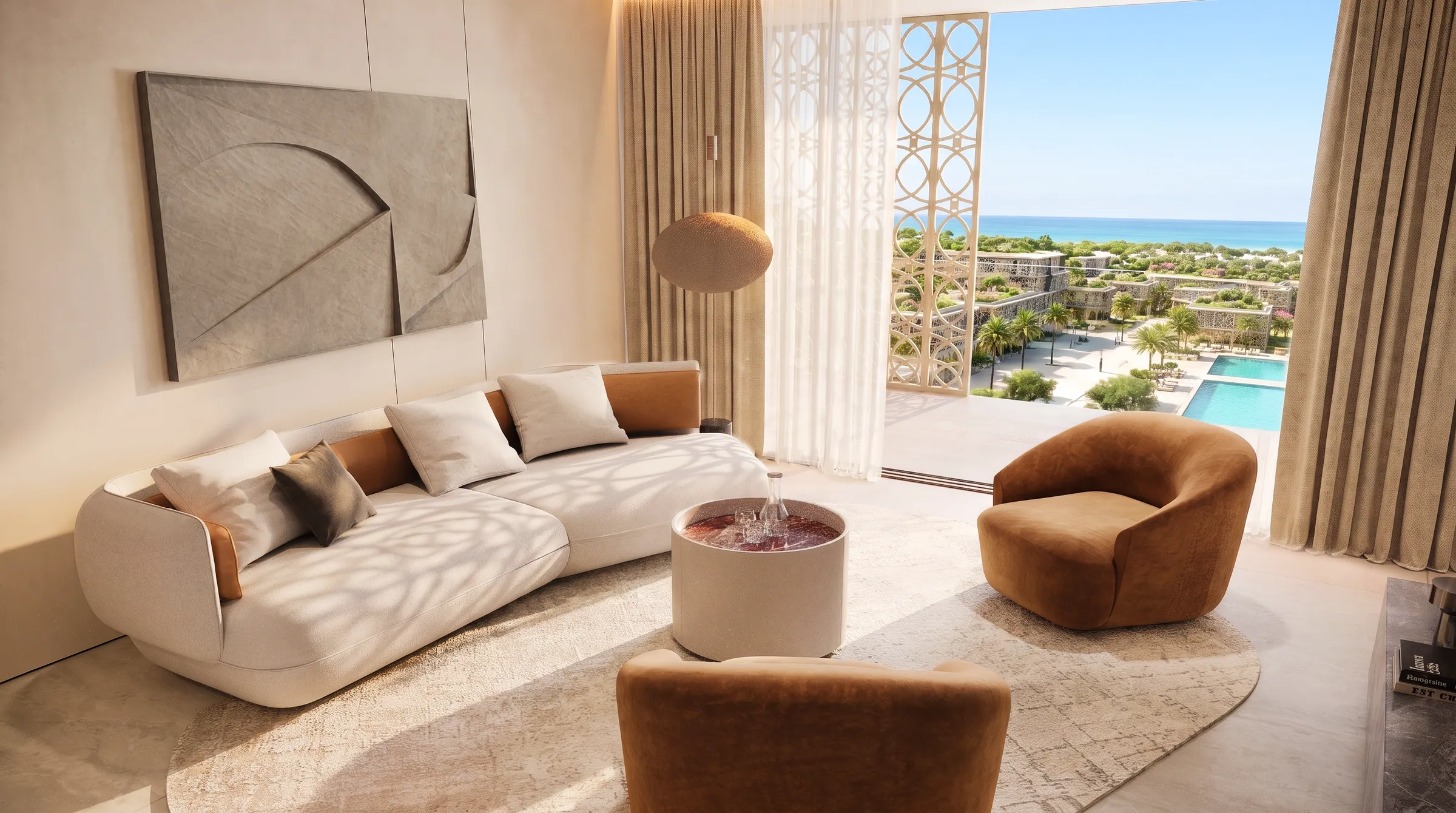 Seating area with a long sofa and armchair facing an open terrace door with the lagoon beyond
